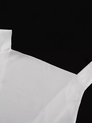 White camisole with thin straps and a square neckline.