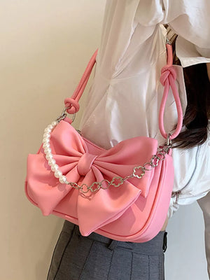 Pink bowknot shoulder bag with pearl chain and clover detail
