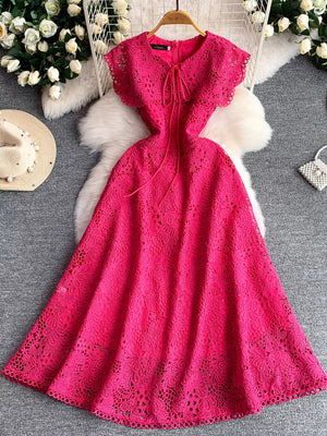 Fuchsia pink lace A-line dress with tie detail and cap sleeves.