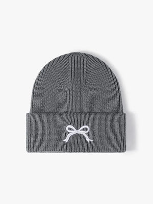 Gray ribbed knit beanie with embroidered white bow detail