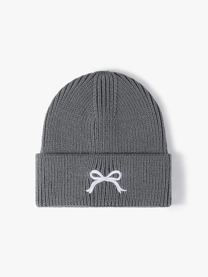Gray ribbed knit beanie with embroidered white bow detail