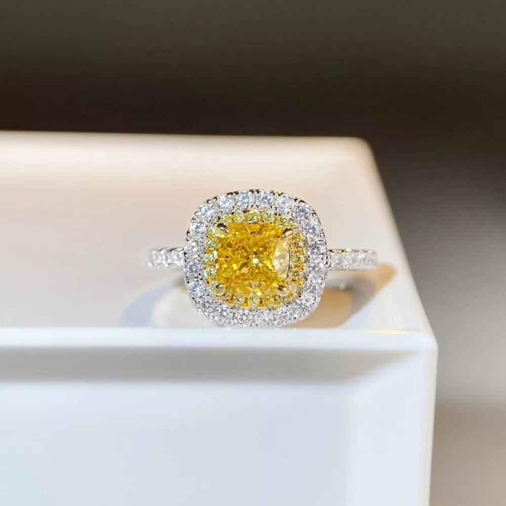 ring in yellow featuring cushion cut center stone and band fit