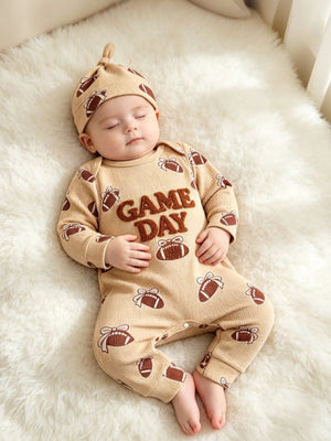 dark brown jumpsuit featuring long sleeve and novelty print