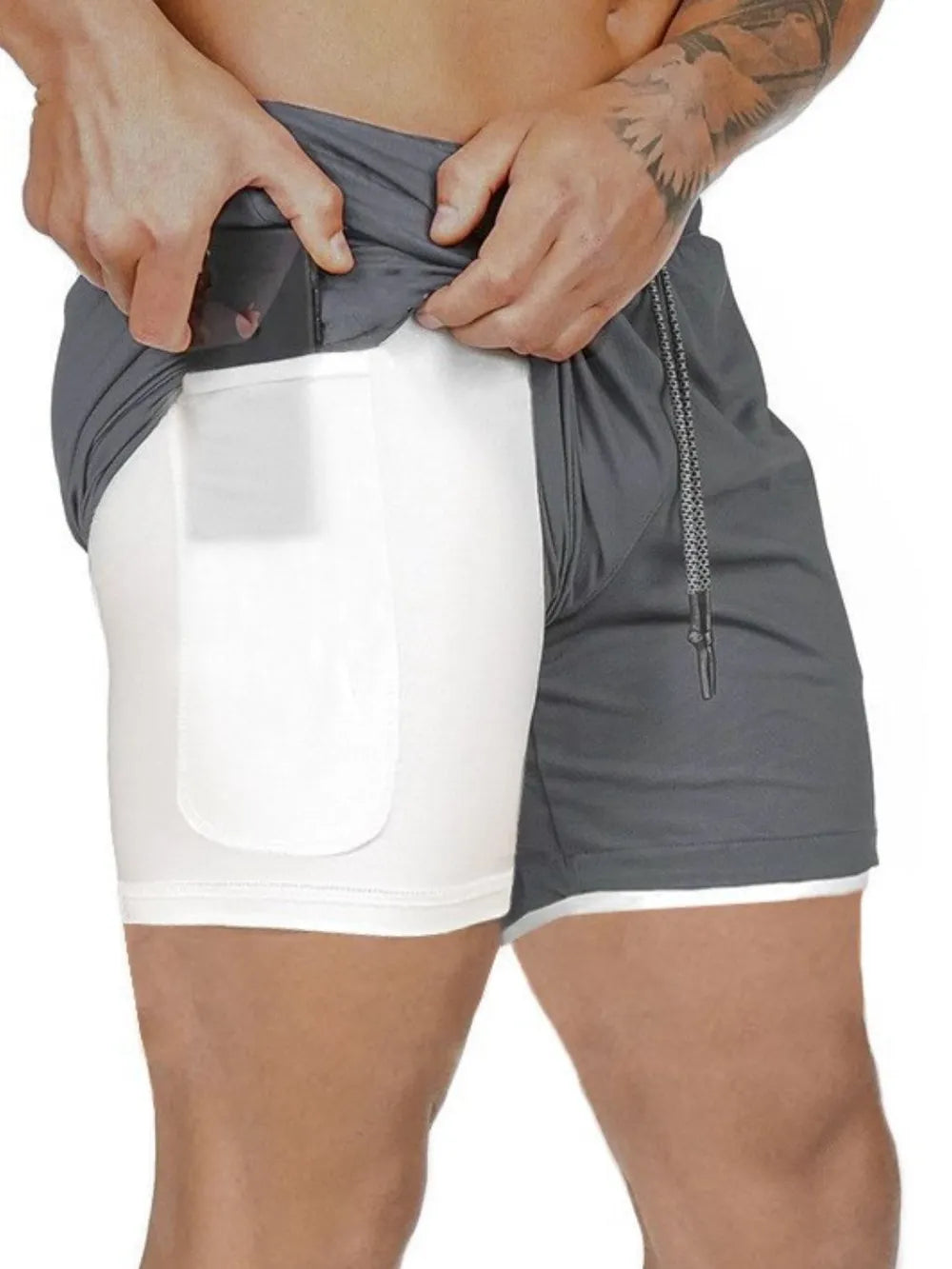 Gray dual-layer performance shorts with white built-in liner and phone pocket detail.