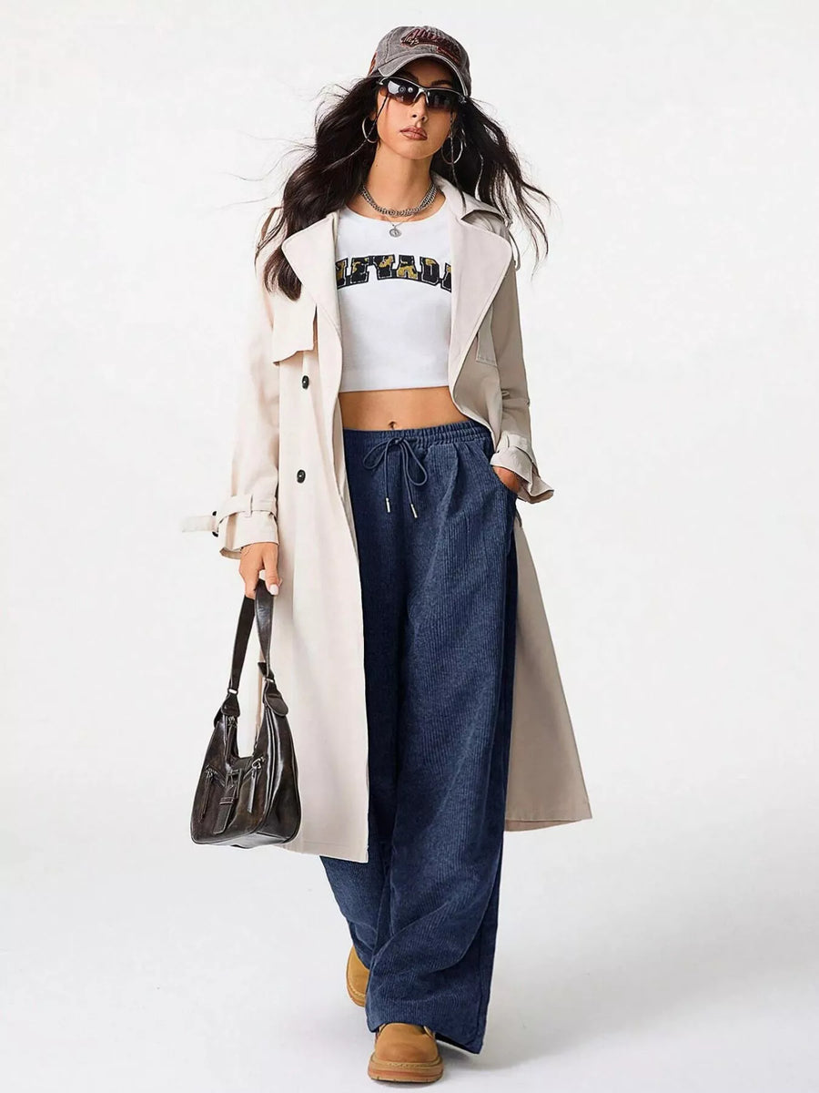 Relaxed blue corduroy drawstring pants with a wide leg.