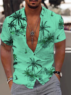 Men's light green button-down shirt with tropical palm tree and sailboat print.