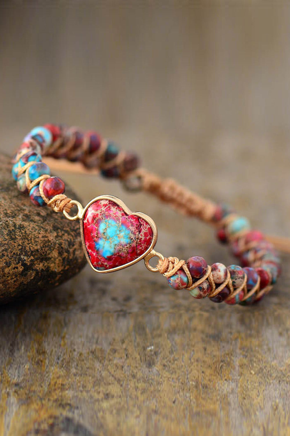 Heart stone beaded bracelet with multicolor stones and gold-tone setting.