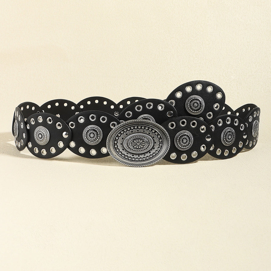 Black leather belt with eyelets and antique silver oval buckle and decorative studs.