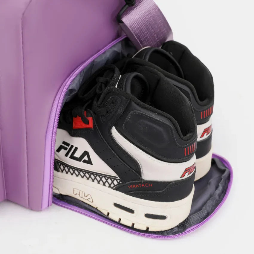 Utility Pocket Weekender Bag in Heliotrope Purple with black and white Fila sneakers in shoe compartment
