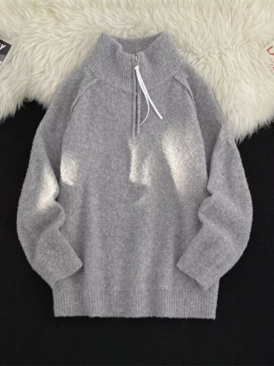 Men's gray half-zip sweater with a high neck and white drawstring detail.