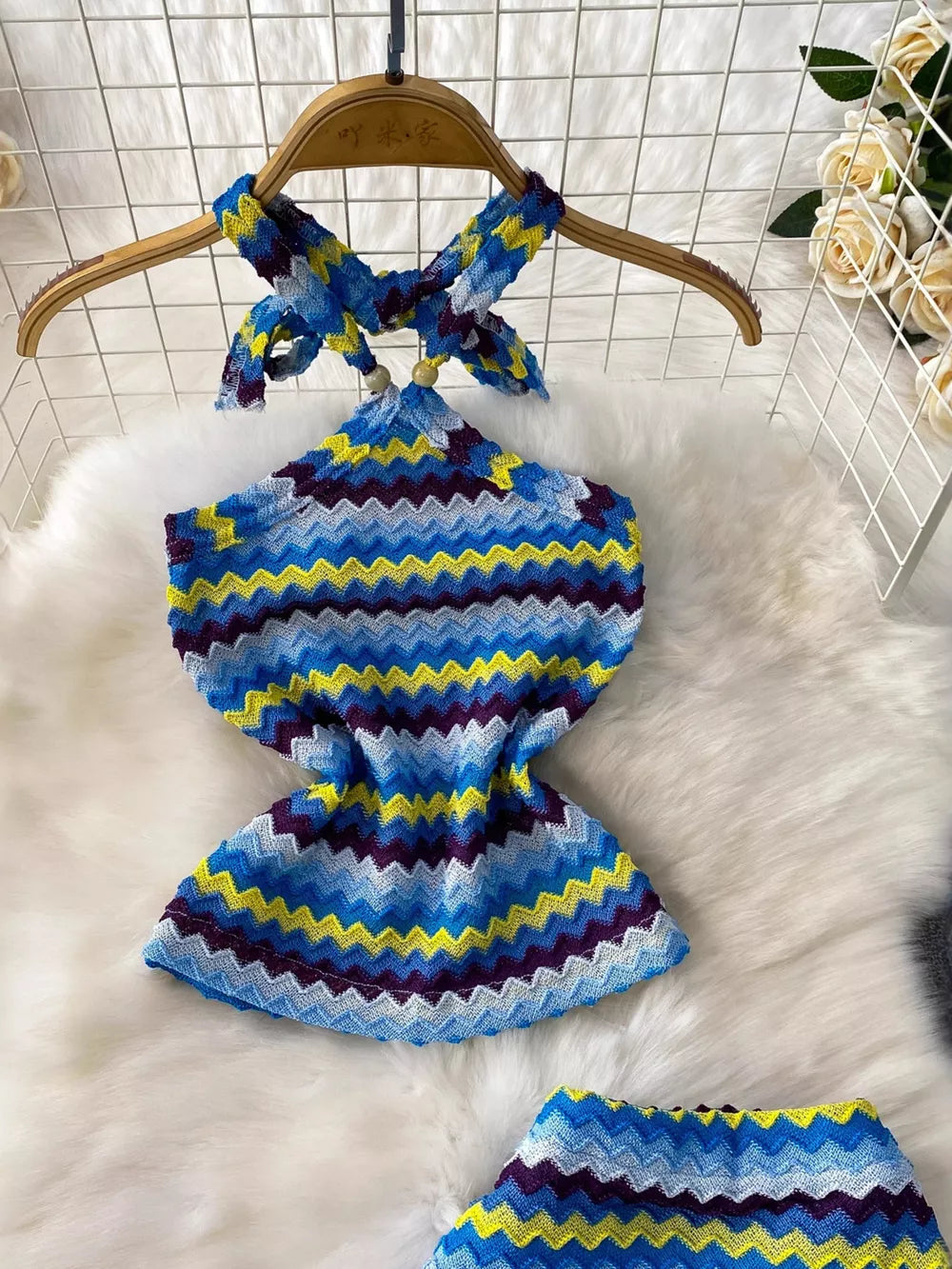 Chevron knit halter crop top and maxi skirt set in blue, yellow, and purple zigzag pattern.
