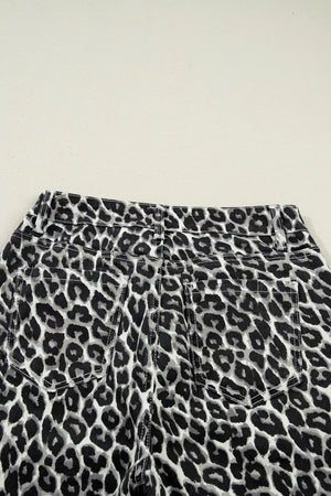 Chic cropped leopard print denim jeans with back pockets and adjustable waist detail.
