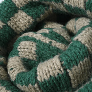 Checkerboard knit beanie in dark green and khaki.