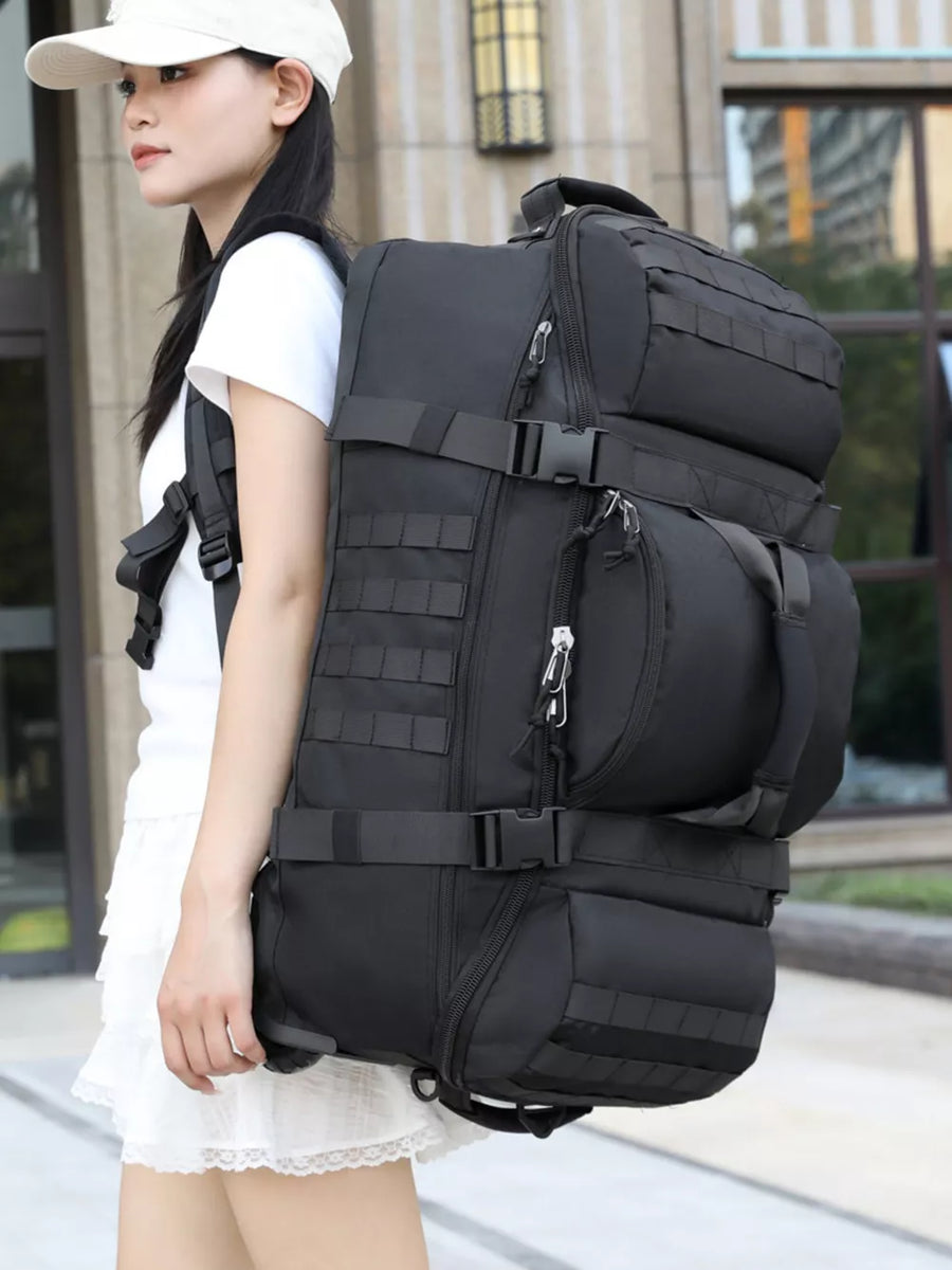 Black tactical backpack with multiple compartments and molle webbing.