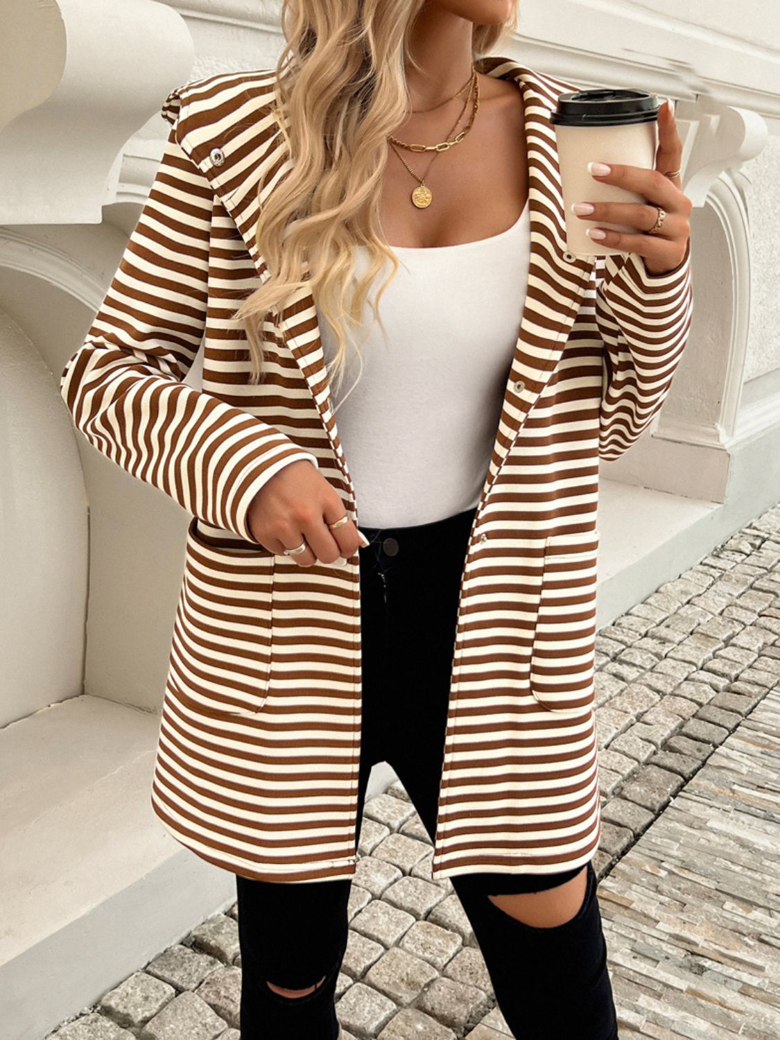 Brown and white striped hooded blazer with patch pockets and a relaxed fit.