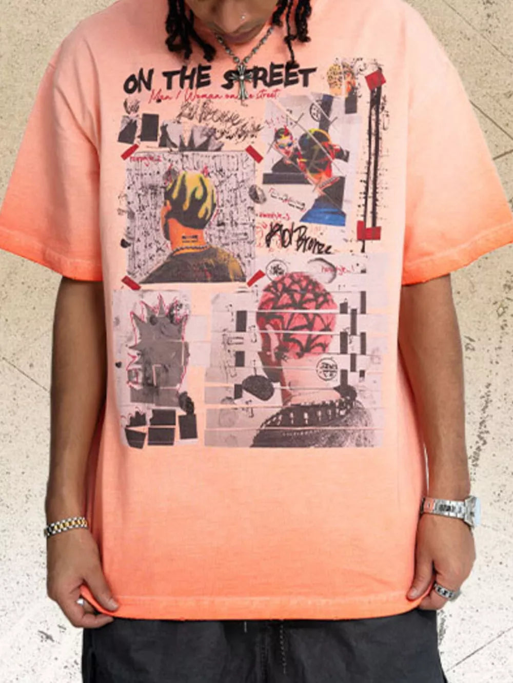 Orange graphic t-shirt with round neck and collage art print.