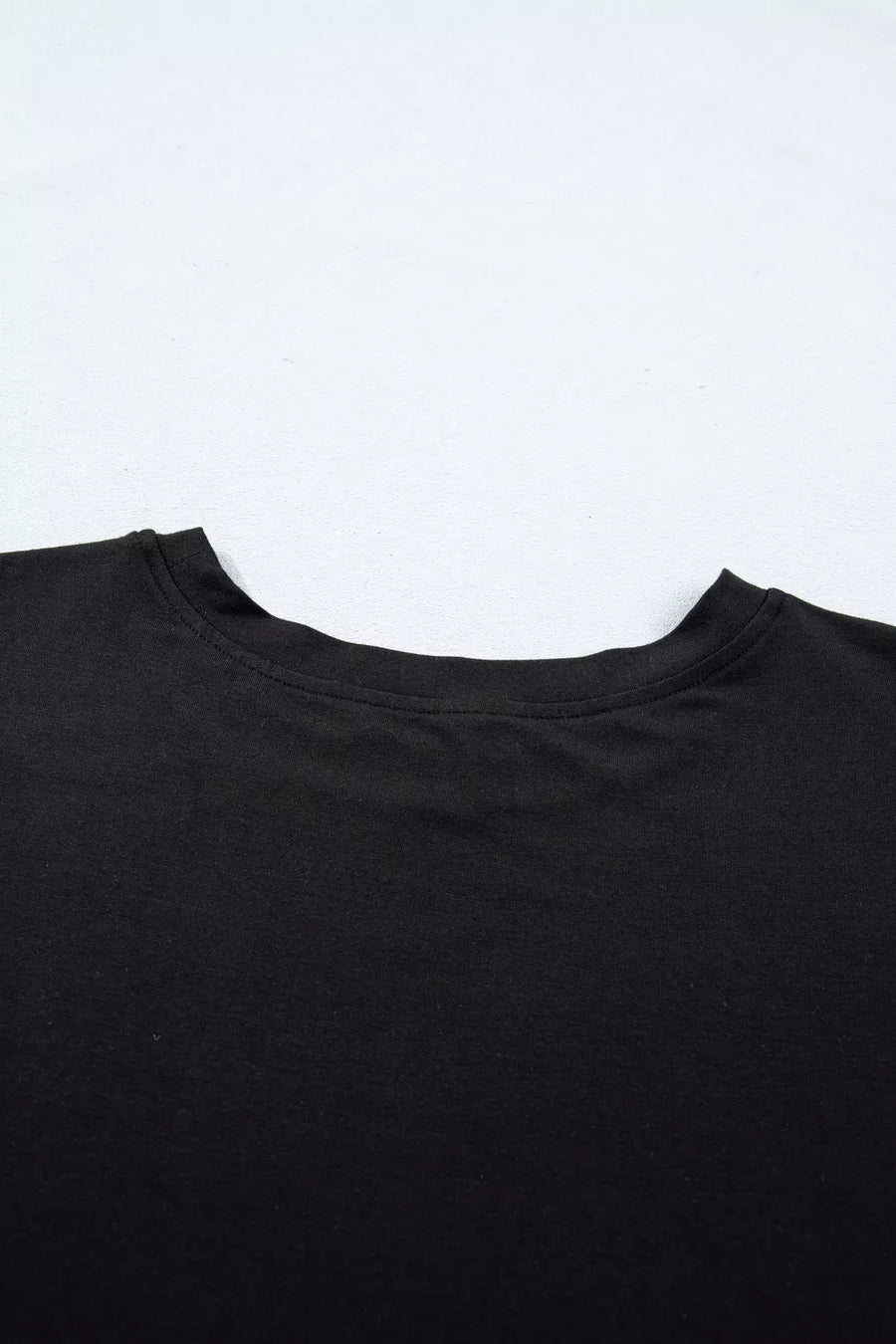Black crew neck t-shirt detail, casual women's apparel