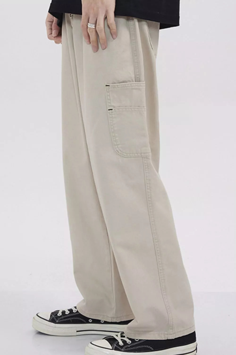 Relaxed fit beige cargo sweatpants with a utility pocket detail.