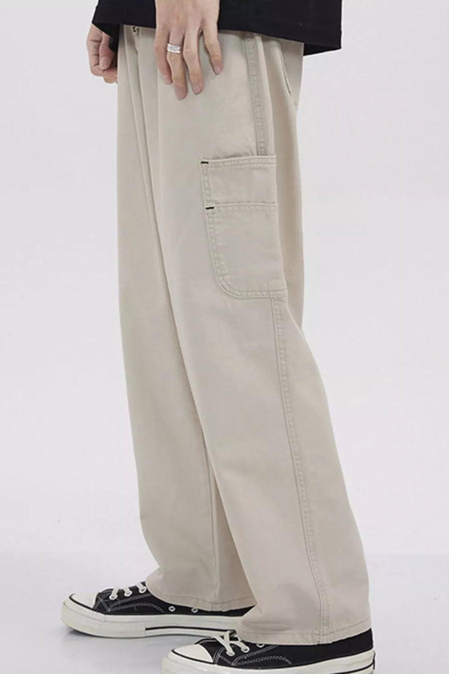 Relaxed fit beige cargo sweatpants with a utility pocket detail.