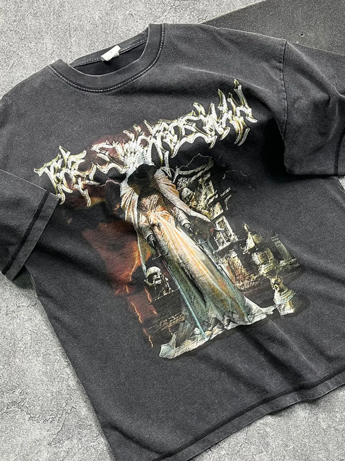 Vintage wash black graphic tee with a dark, detailed print and crew neck.