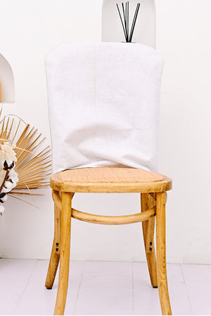 Patriotic Gnome chair back cover in multicolor fabric draped over a wooden chair.