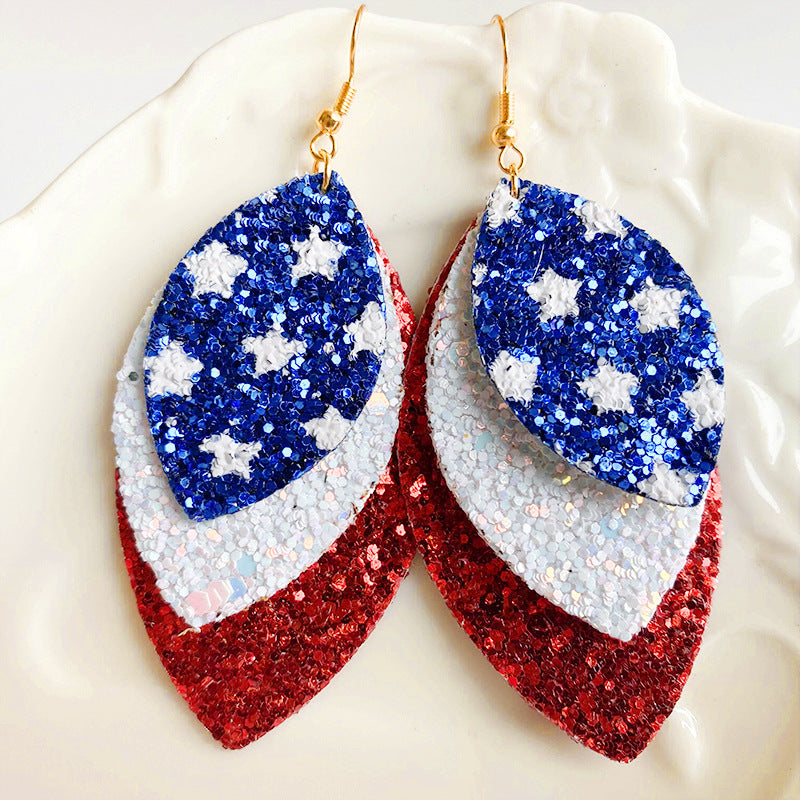 Patriotic layered glitter leaf earrings with red, white, and blue star pattern.