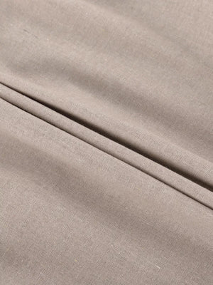 Textured beige linen fabric with soft folds