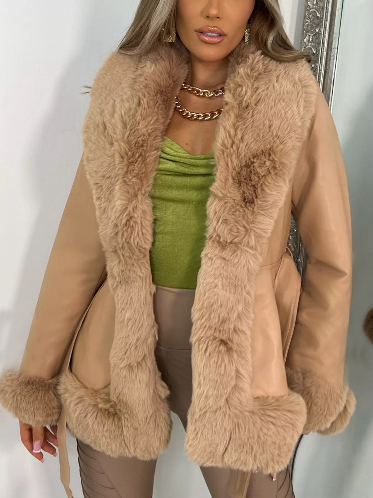 Beige belted faux fur trim coat with textured faux leather.