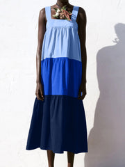 Three-tone wide strap dress with square neckline and tiered skirt in light blue, royal blue, and navy.