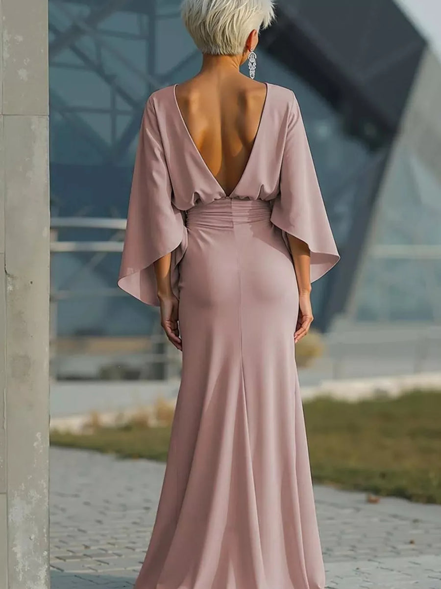 Pink batwing sleeve maxi dress with deep V-back and cinched waist, flowing to the floor.