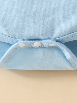 Light blue baby bodysuit detail showing white snap closures and ribbed trim.