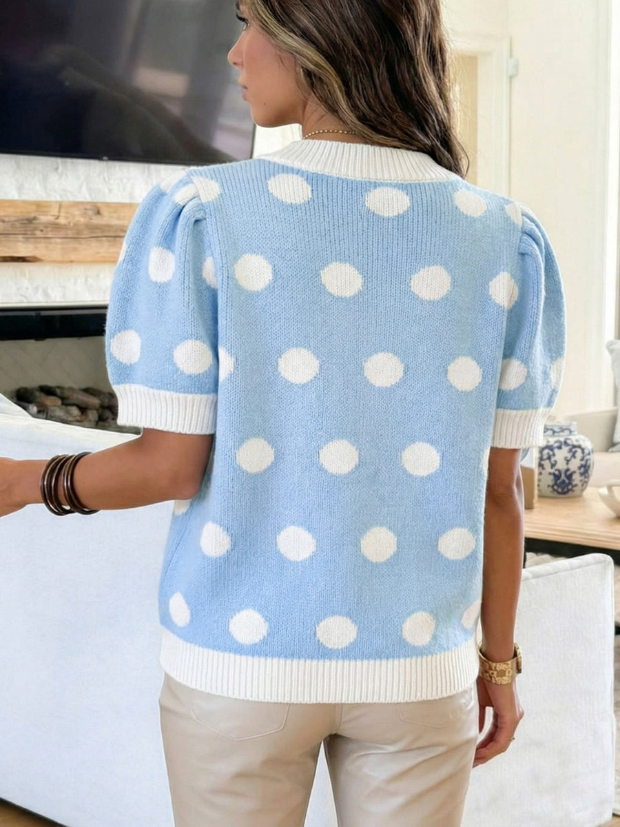 Blue polka dot knit sweater with puff sleeves and white trim
