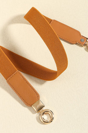 Caramel elastic belt with faux leather ends and gold hardware detail