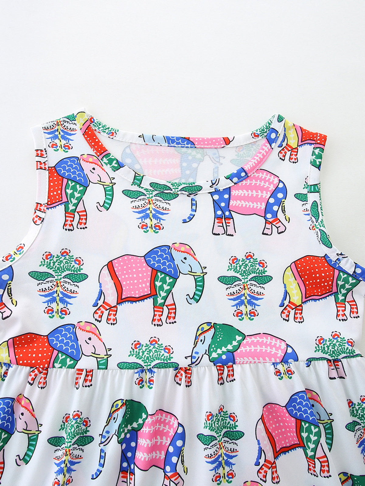 Toddler dress with a colorful elephant print and round neckline.