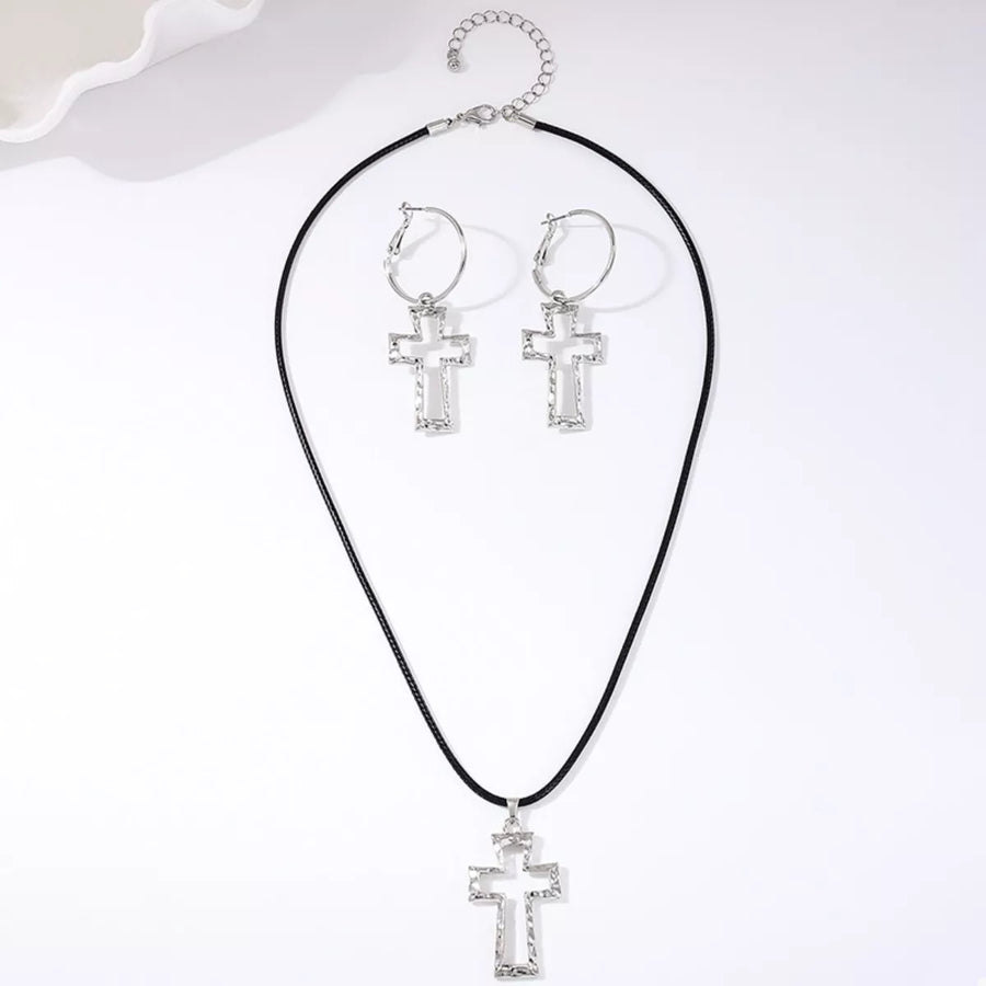Silver cross pendant necklace and hoop earrings set with black cord chain.