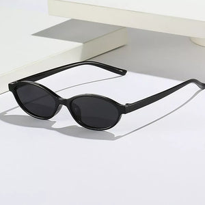 PC Frame material: Polycarbonate Lens material: Polycarbonate Temple material: P sunglasses in Black with oval silhouette