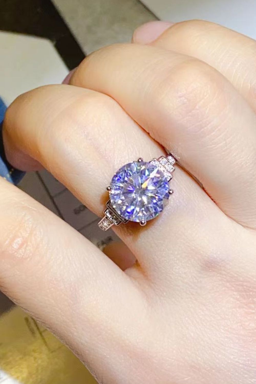 Radiant cut halo sterling silver ring with brilliant sparkle.