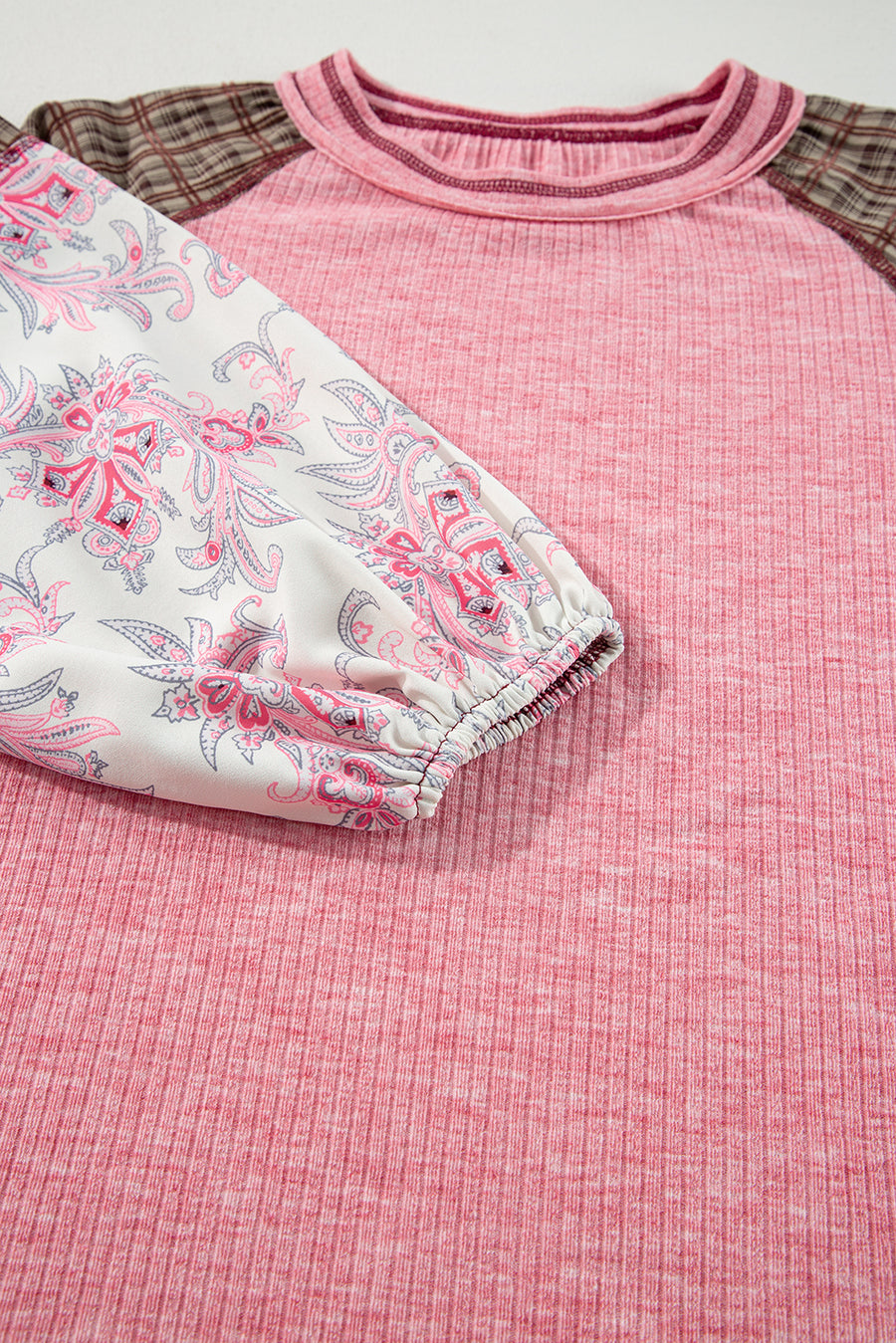 Paisley puff sleeve raglan tee in dusty pink with contrast plaid sleeves and crew neck.
