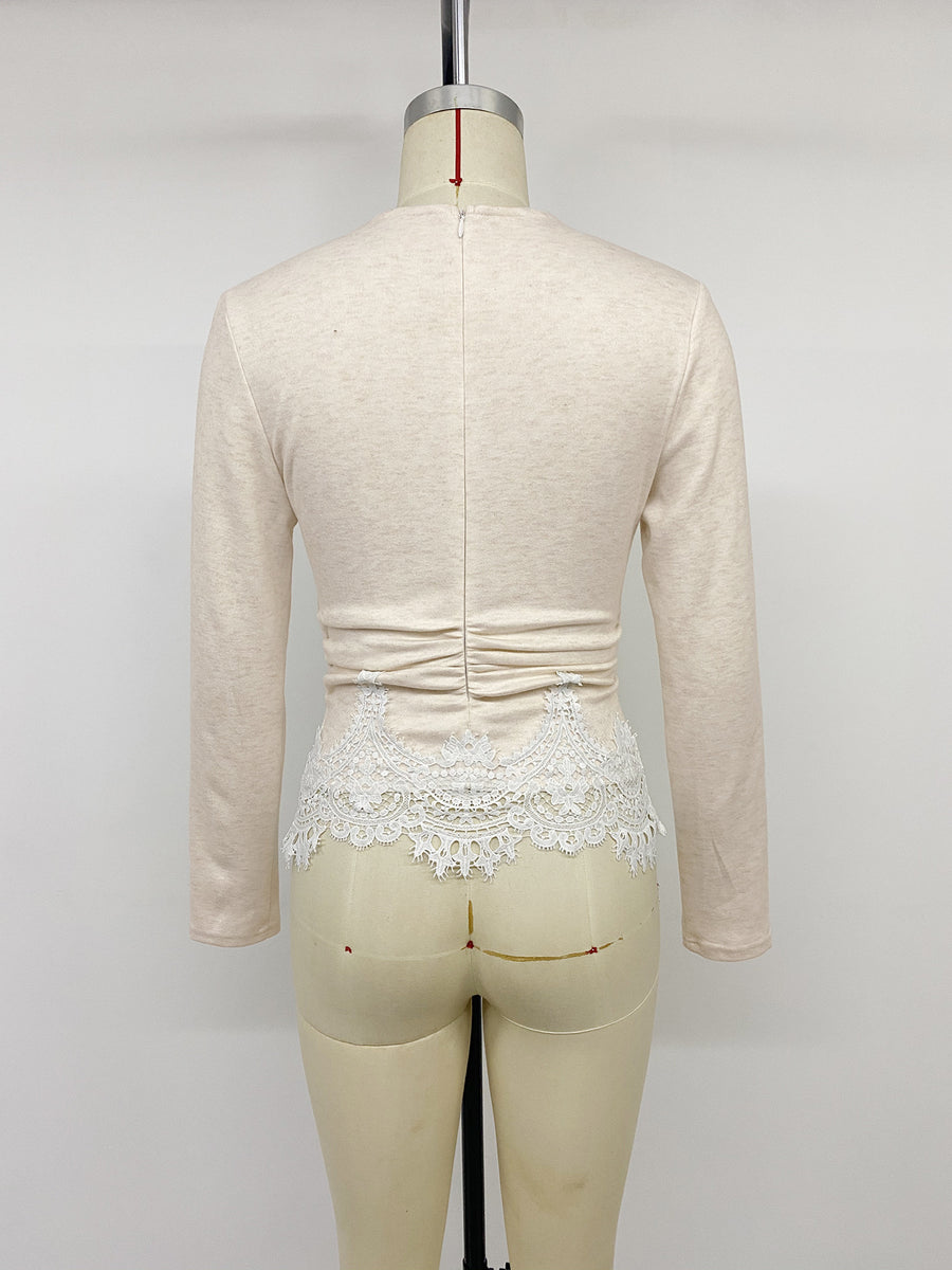Beige long sleeve top with white lace trim and ruched waist