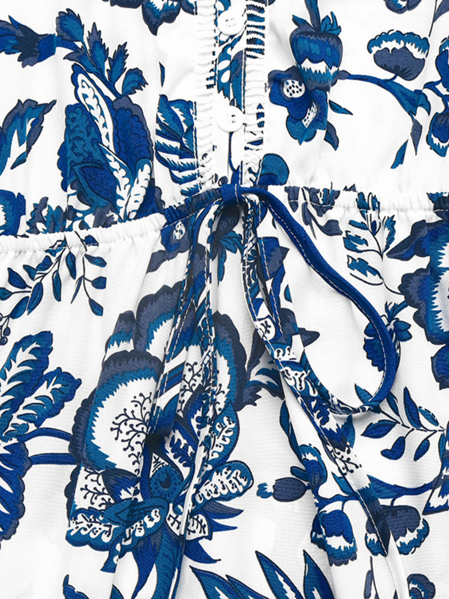 Charming floral midi dress in dark blue with drawstring waist and button front detail.