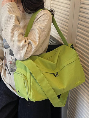 Lime green nylon messenger bag with front zipper pocket and adjustable strap.