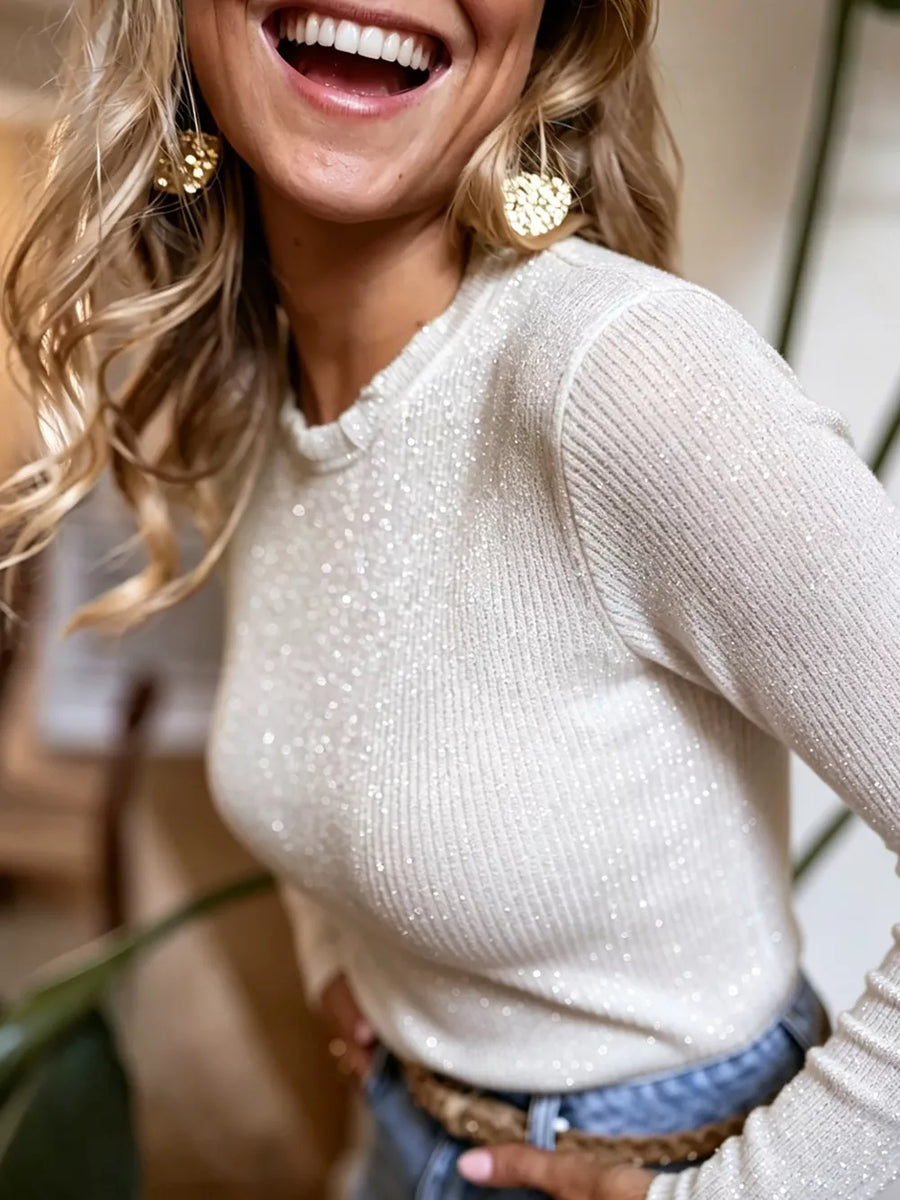 Sparkly white long sleeve sweater with ribbed texture and crew neck.