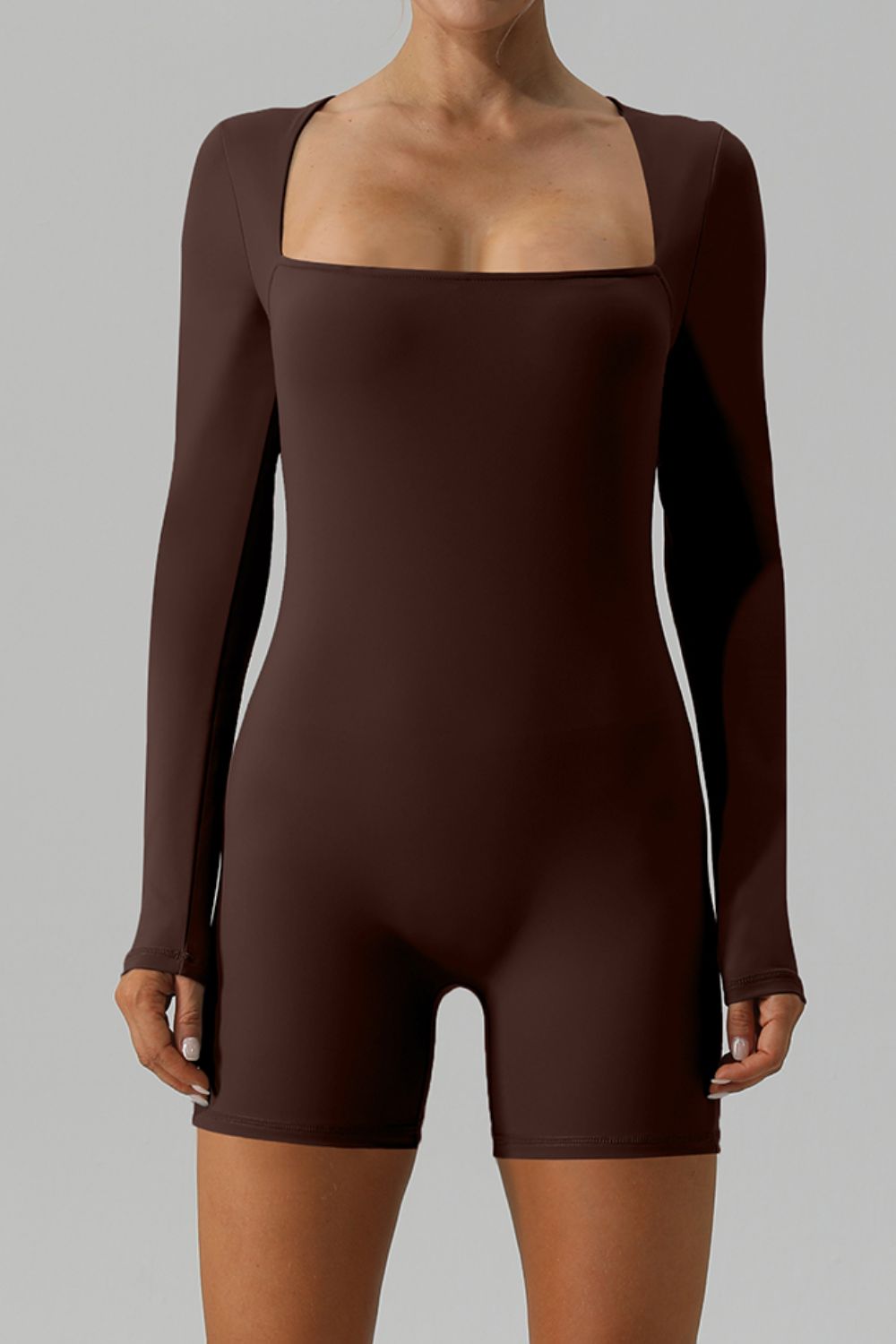 Brown long sleeve unitard with square neckline and short legs.