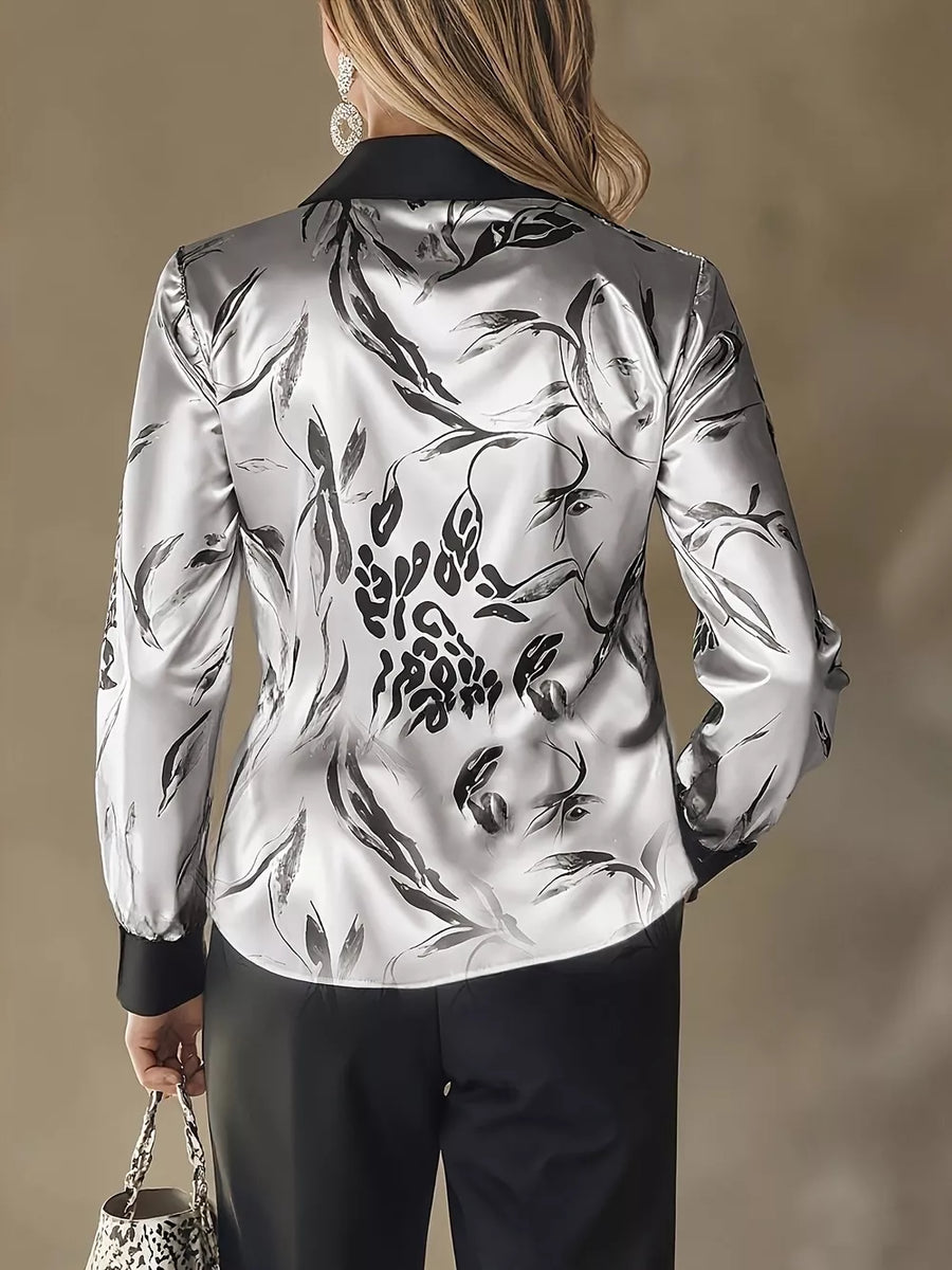 black button-up shirt featuring collared and leopard-print