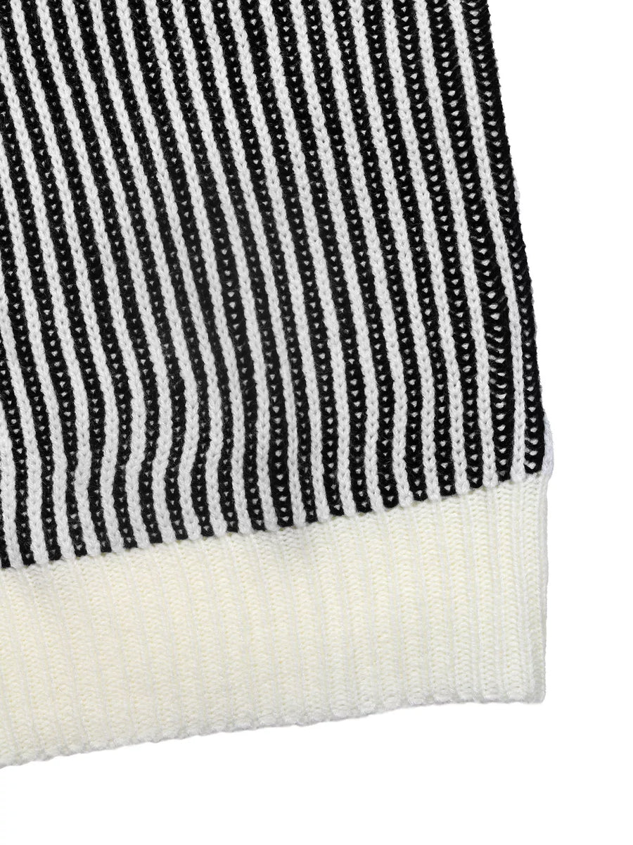 Black and white striped knit sweater with a contrast ribbed hem.