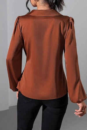 100% polyester Care instructions: Machine wash cold blouse in Black with fitted silhouette