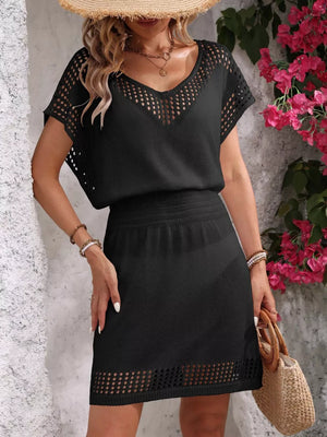 Black perforated knit V-neck cover-up dress with smocked waist and openwork hem.