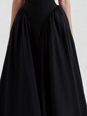 Black halter neck midi dress with gathered skirt detail and pockets.