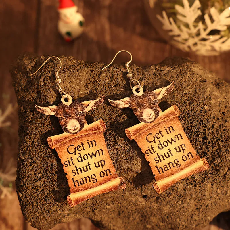 Camel goat head scroll drop earrings with text.