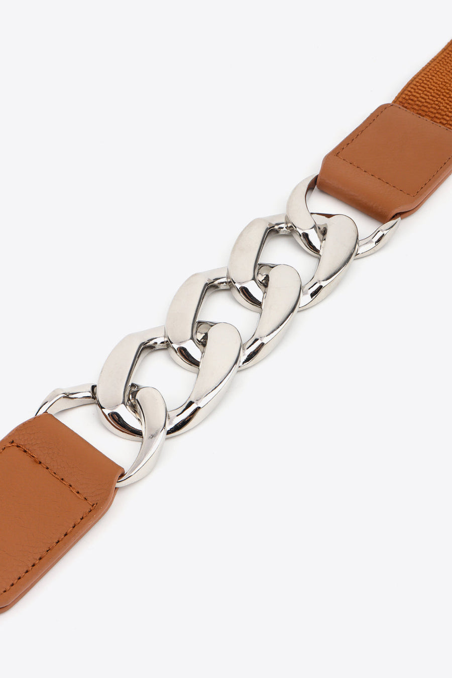 Chunky chain elastic belt with faux leather ends in ochre and silver hardware.